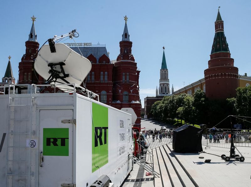 &copy; Reuters. FILE PHOTO: Vehicles of Russian state-controlled broadcaster Russia Today (RT) are seen near the Red Square in central Moscow, Russia June 15, 2018. Picture taken June 15, 2018.  REUTERS/Gleb Garanich/File Photo