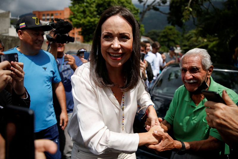 &copy; Reuters. Frontrunner Maria Corina Machado greets people after casting her vote in a primary to choose a unity opposition candidate to face Venezuela's President Nicolas Maduro in his probable re-election bid in 2024, in Caracas, Venezuela October 22, 2023. REUTERS