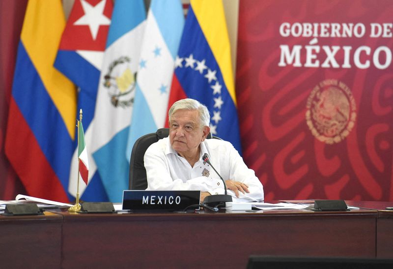 &copy; Reuters. Mexico's President Andres Manuel Lopez Obrador listens during a summit of leaders from Latin America and the Caribbean in the southern city of Palenque looking to broker accords to curb a recent jump in migrants bound for the U.S. border, in Palenque, Mex