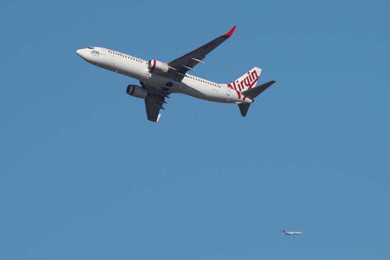 &copy; Reuters. FILE PHOTO: A Virgin Australia Airlines plane takes off from Kingsford Smith International Airport in Sydney, Australia, March 18, 2020.  REUTERS/Loren Elliott