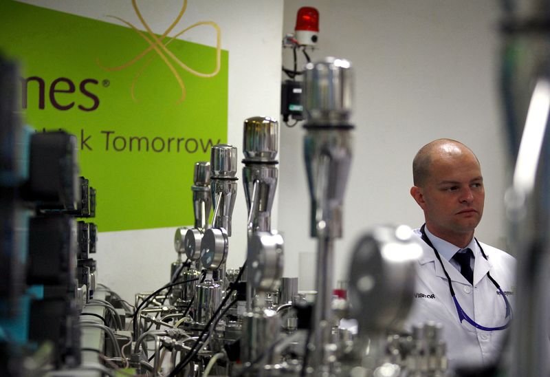 &copy; Reuters. FILE PHOTO: A worker for the Danish biopharmaceutical company Novozymes stands next to fermentation vates for producing enzymes at a factory in Beijing, China, May 24, 2011. To match Interview NOVOZYMES-CEO/   REUTERS/David Gray//File Photo