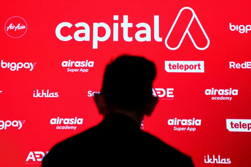 &copy; Reuters. FILE PHOTO: Capital A Berhad's logo is seen among its subsidiary companies during a ceremony announcing a name change of the group holding company from AirAsia Group Berhad, in Kuala Lumpur, Malaysia, January 28, 2022. REUTERS/Hasnoor Hussain/File photo