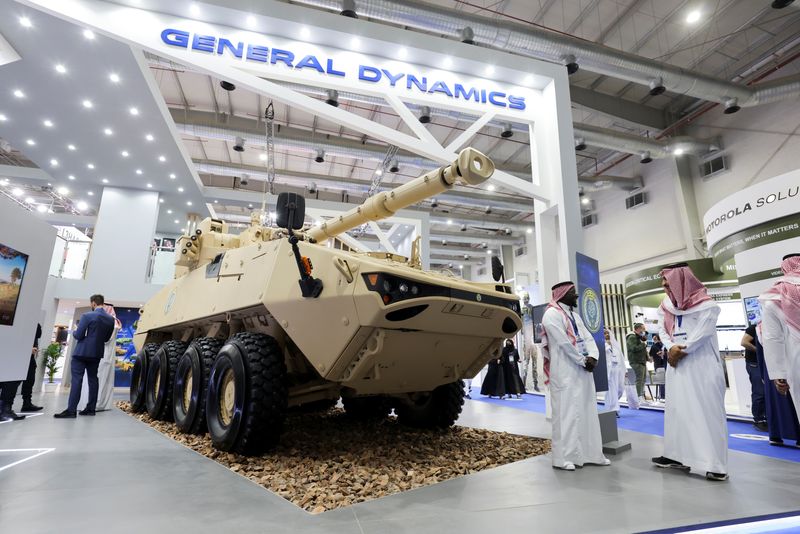 &copy; Reuters. FILE PHOTO: Saudi men are seen at General Dynamics stand displaying the latest defence system at World Defense Show in Riyadh, Saudi Arabia, March 6, 2022. REUTERS/Ahmed Yosri/File Photo
