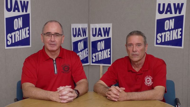 © Reuters. UAW President Shawn Fain and UAW Vice President Chuck Browning announce an update about The United Auto Workers (UAW) standup strike, at an unknown location, in this screengrab from a handout video released on October 25, 2023. UAW International Union Via Facebook/Handout via REUTERS