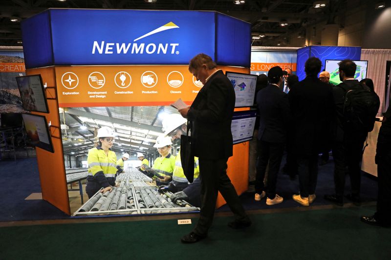 &copy; Reuters. FILE PHOTO: People visit the booth of U.S. gold mining company Newmont Corporation at the Prospectors and Developers Association of Canada (PDAC) annual conference in Toronto, Ontario, Canada March 7, 2023. REUTERS/Chris Helgren/File photo
