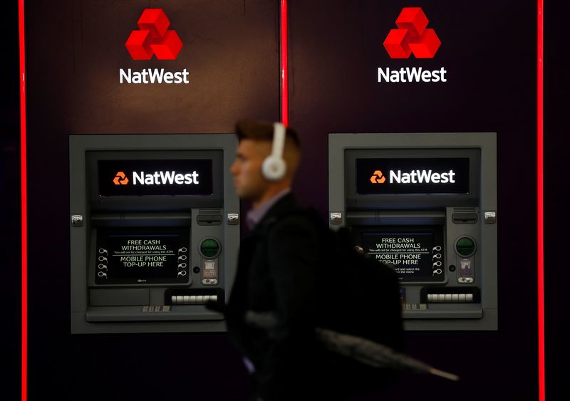 &copy; Reuters. FILE PHOTO: A man walks past ATM machines at branch of the NatWest bank in Manchester, Britain September 21, 2017. Picture taken September 21, 2017.    REUTERS/Phil Noble/File Photo
