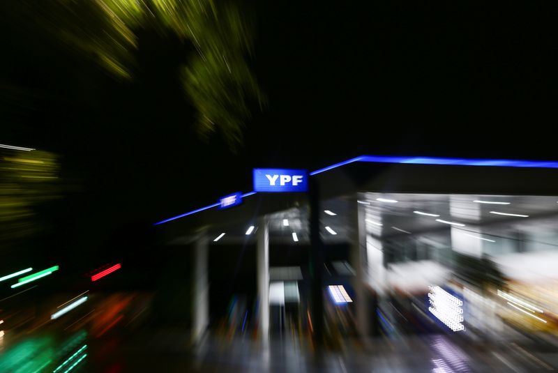 &copy; Reuters. FILE PHOTO: The logo of Argentina's state energy company YPF is seen at a gas station, in Buenos Aires, Argentina February 10, 2021. Picture taken with a slow shutter speed and a zoom effect. Picture taken February 10, 2021. REUTERS/Matias Baglietto/File 