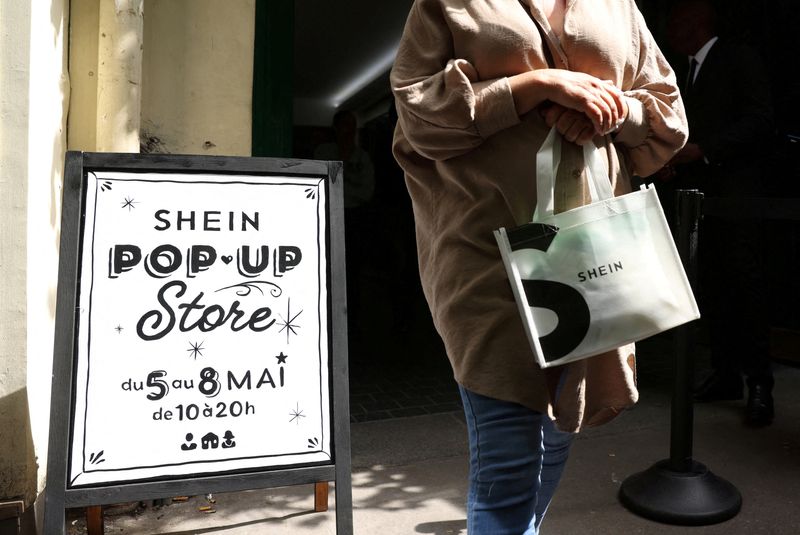 &copy; Reuters. FILE PHOTO: A woman leaves a pop-up store of Chinese fast-fashion retailer Shein in Paris, France, May 5, 2023. REUTERS/Johanna Geron/File Photo