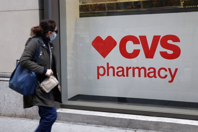 &copy; Reuters. FILE PHOTO: A person walks by a CVS pharmacy store in Manhattan, New York, U.S., November 15, 2021. REUTERS/Andrew Kelly/File Photo