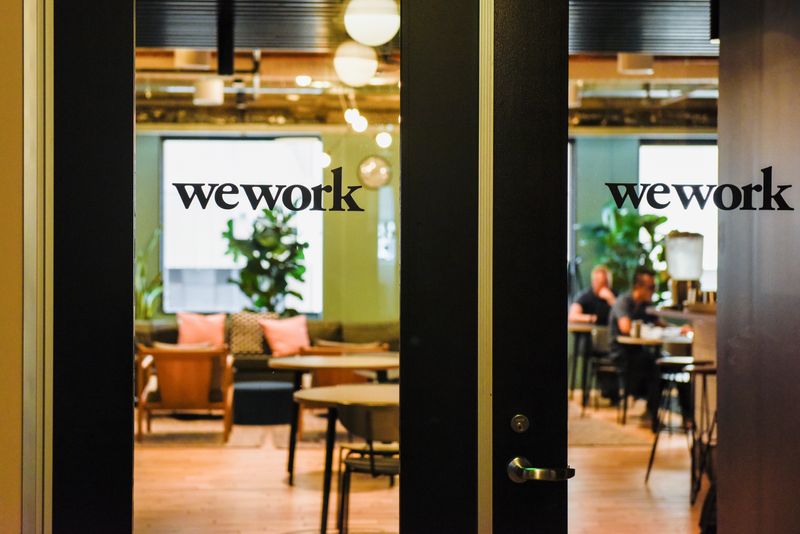 © Reuters. FILE PHOTO: WeWork logos are seen at a WeWork office in San Francisco, California, U.S. September 30, 2019.  REUTERS/Kate Munsch