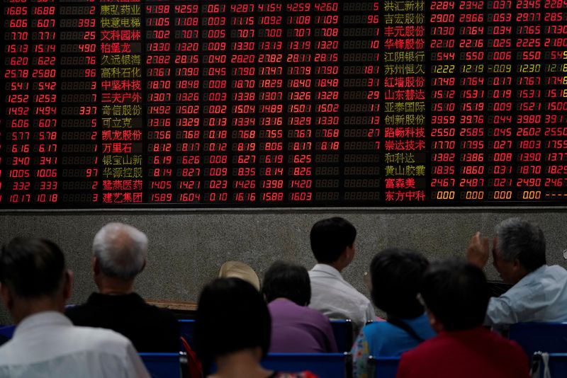 &copy; Reuters. Investors look at an electronic board showing stock information at a brokerage house in Shanghai, China September 7, 2018. REUTERS/Aly Song