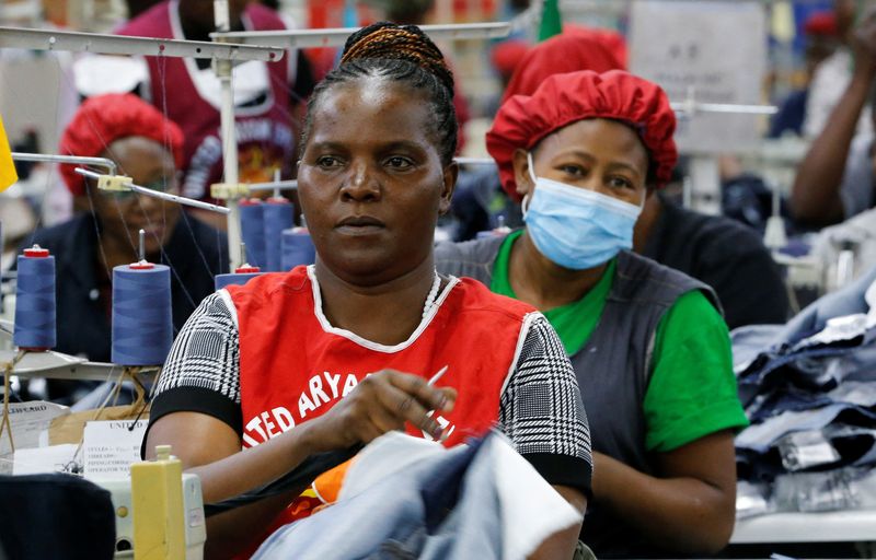 © Reuters. Norah Nasimiyu works on denim trousers for export at the United Aryan Export Processing Zone (EPZ) factory, operating under The U.S. African Growth and Opportunity Act (AGOA), in Ruaraka district of Nairobi, Kenya October 26, 2023. REUTERS/Thomas Mukoya/File photo