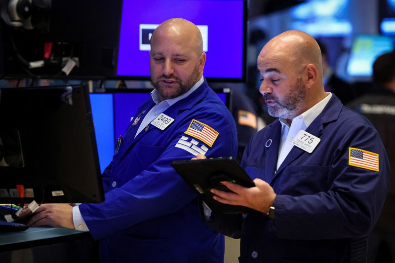 US stocks rally as Fed holds rates, prompts hope for end to hikes