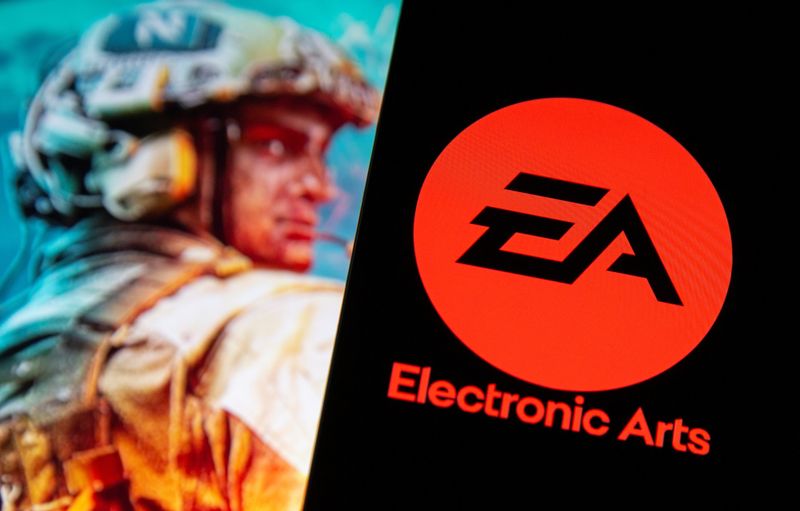 © Reuters. A smartphone with the Electronic Arts logo is seen in front of a displayed character from the Battlefield 2042 game in this illustration taken September 16, 2021. REUTERS/Dado Ruvic/Illustration