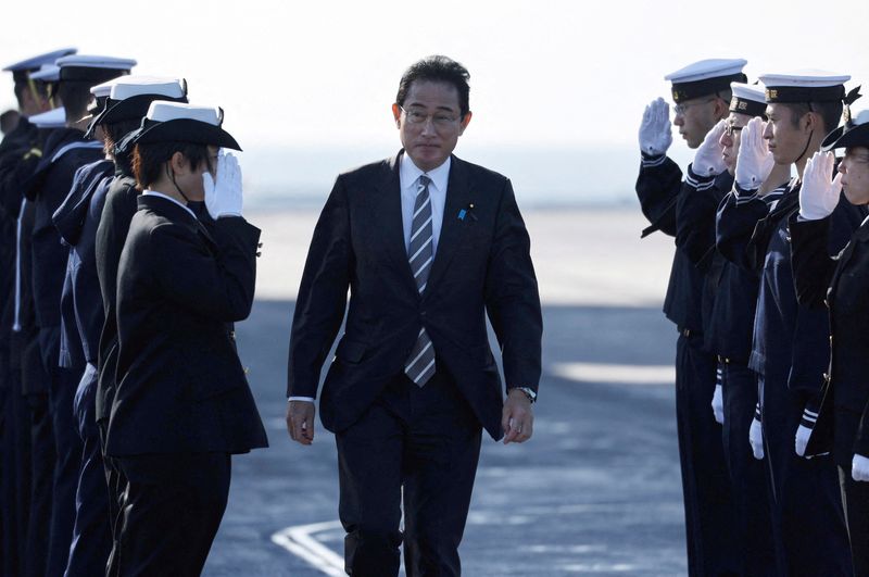 &copy; Reuters. FILE PHOTO: Japan's Prime Minister Fumio Kishida receives salutes from Japan Maritime Self-Defence Force (JMSDF) soldiers during the International Fleet Review to commemorate the 70th anniversary of the foundation of the JMSDF, at Sagami Bay, off Yokosuka