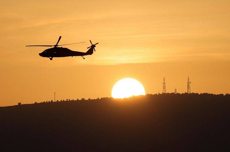 &copy; Reuters. An Israeli military helicopter flies over Northern Israel near the border with Lebanon November 2, 2023. REUTERS/Violeta Santos Moura/ File Photo