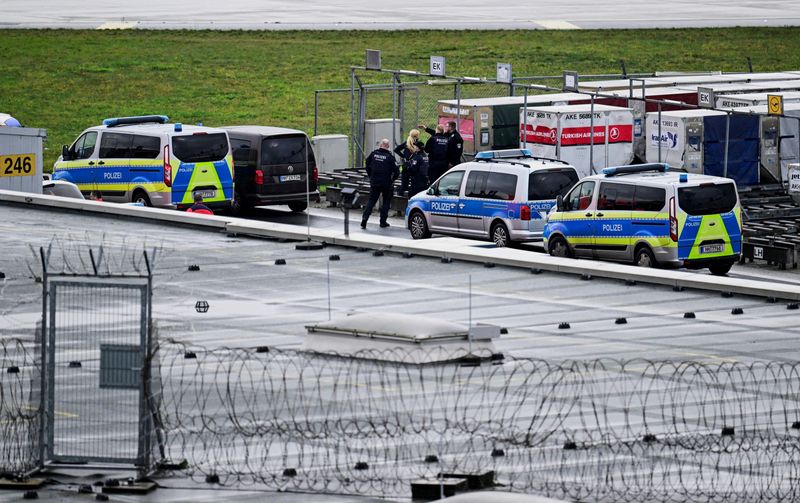 &copy; Reuters. Police secure the area after a man drove through a barrier onto the grounds of the city's airport with a child in his car in Hamburg, Germany, November 5, 2023.     REUTERS/Fabian Bimmer