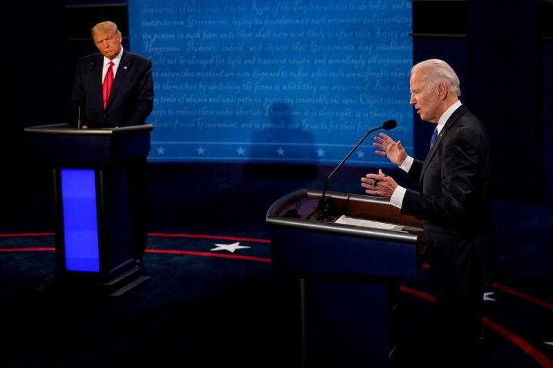 &copy; Reuters. FILE PHOTO: Democratic presidential candidate former Vice President Joe Biden answers a question as President Donald Trump listens during the second and final presidential debate at the Curb Event Center at Belmont University in Nashville, Tennessee, U.S.