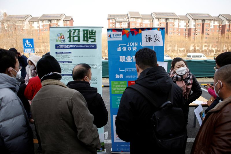 &copy; Reuters. FILE PHOTO: Job seekers attend a job fair in Beijing, China February 16, 2023. REUTERS/Florence Lo/File Photo