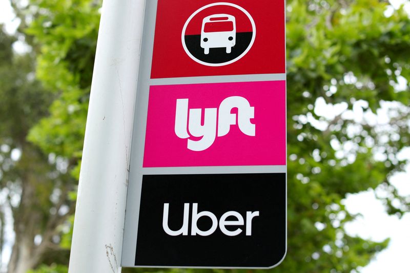 &copy; Reuters. FILE PHOTO: A sign marks a rendezvous location for Lyft and Uber users at San Diego State University in San Diego, California, U.S., May 13, 2020. REUTERS/Mike Blake/File Photo