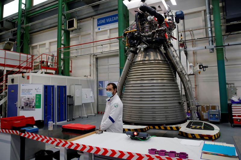&copy; Reuters. A worker of Ariane Group stands in front of a Ariane 6 rocket's Vulcain 2.1 engine, prior to the visit of French President Emmanuel Macron, in Vernon, France January 12, 2021. Christophe Ena/Pool via REUTERS/File Photo