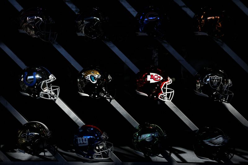 &copy; Reuters. FILE PHOTO: NFL football helmets are seen on display in Tampa, Florida, U.S., February 3, 2021. REUTERS/Eve Edelheit/File Photo