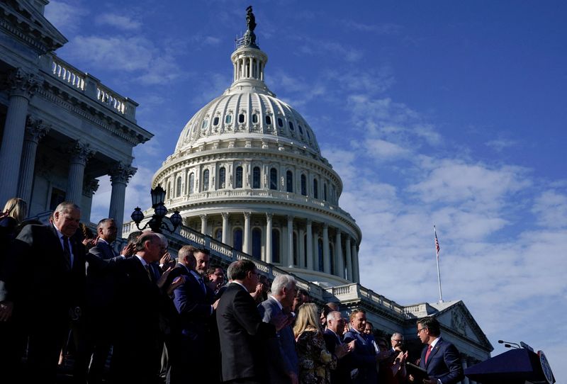 &copy; Reuters. FILE PHOTO: Newly elected Speaker of the House Mike Johnson (R-LA) speaks to members of the Republican conference gathered on the outer steps of the House of Representatives to listen to him deliver remarks after he was elected to be the new Speaker at th