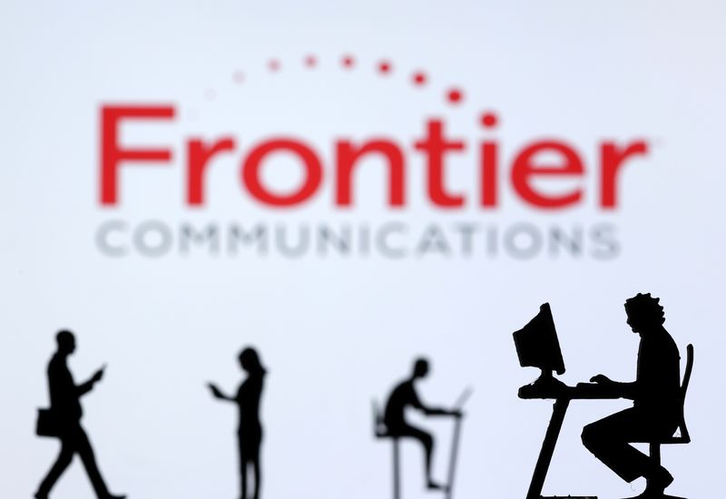 &copy; Reuters. Small toy figures with laptops and smartphones are seen in front of displayed Frontier Communications logo, in this illustration taken December 5, 2021. REUTERS/Dado Ruvic/Illustration/File Photo