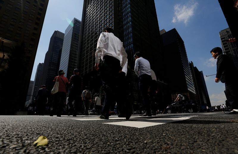 &copy; Reuters. People walk on a crosswalk at a business district in central Tokyo, Japan September 29, 2017. Picture taken September 29, 2017. REUTERS/Toru Hanai