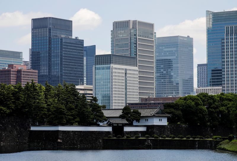 &copy; Reuters. Sakuradamon Gate of the Imperial Palace stands in front of high-rise buildings in Marunouchi business district in Tokyo, Japan, June 1, 2021. REUTERS/Kim Kyung-Hoon/File Photo