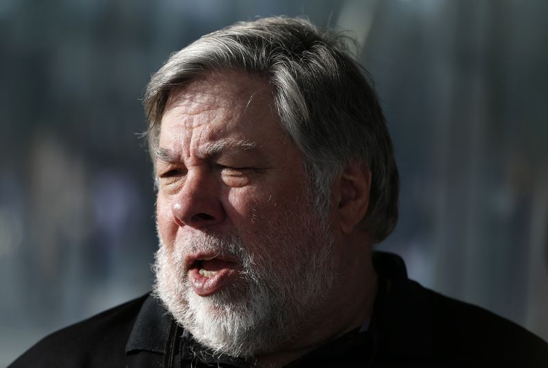 &copy; Reuters. Steve Wozniak, co-founder of Apple, talks to people during a launch event in Cupertino, California, U.S., September 12, 2017. REUTERS/Stephen Lam