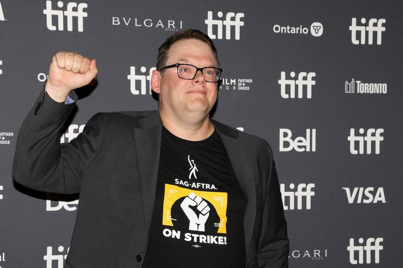 &copy; Reuters. FILE PHOTO: Duncan Crabtree-Ireland, National Executive Director and Chief Negotiator of SAG-AFTRA, pumps a fist during the international premiere of The Boy and the Heron at the Toronto International Film Festival (TIFF) in Toronto, Ontario, Canada Septe