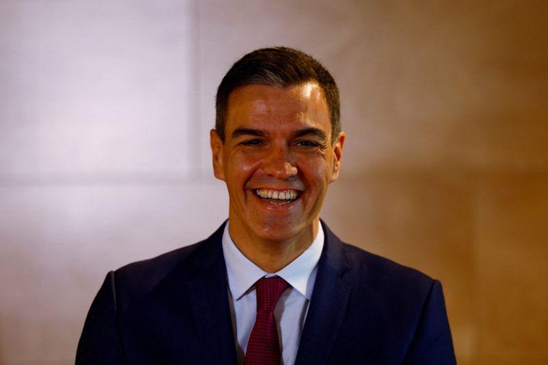&copy; Reuters. Spain's acting Prime Minister Pedro Sanchez smiles after signing an agreement with Andoni Ortuzar, the president of the Basque Nationalist Party (PNV), that will support Sanchez's bid to clinch another term in office at the Parliament in Madrid, Spain, No