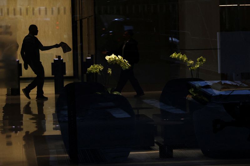 &copy; Reuters. A man is seen in silhouette near flowers at an office building in the financial district of New York City, U.S., June 14, 2023.  REUTERS/Shannon Stapleton/File Photo