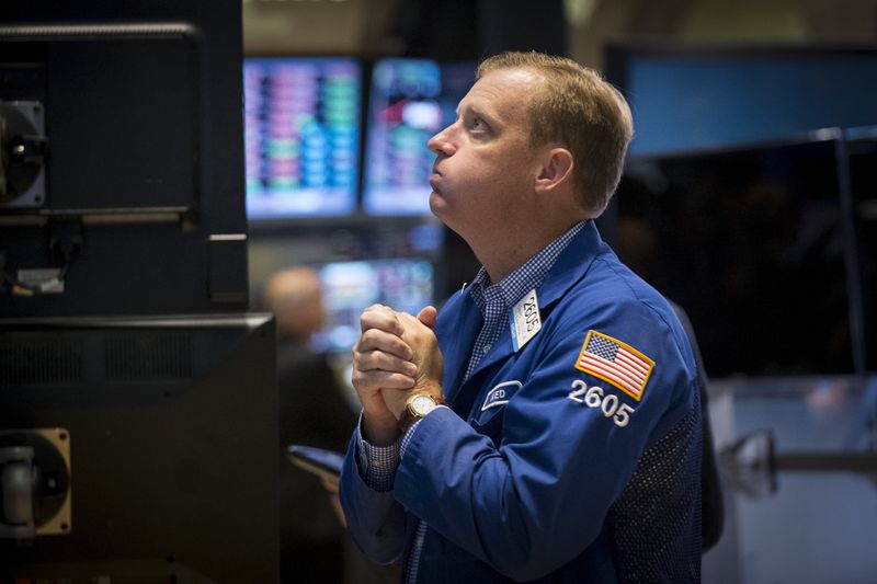 &copy; Reuters. FILE PHOTO: Specialist trader Ned Zelles works at his post on the floor of the New York Stock Exchange, August 21, 2015. REUTERS/Brendan McDermid/File Photo