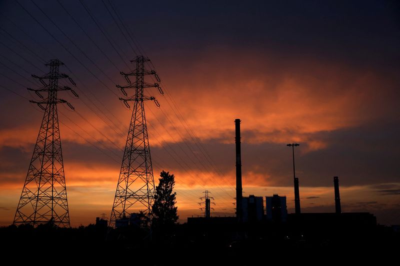 &copy; Reuters. FILE PHOTO: Electric poles are pictured in front of the PGNiG Termika Zeran thermal power station after sunset in Warsaw, Poland June 19, 2019. REUTERS/Kacper Pempel/File Photo