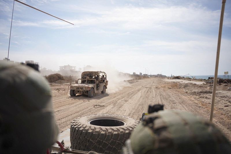 &copy; Reuters. Israeli soldiers drive a military vehicle, amid the ongoing ground operation of the Israeli army against Palestinian Islamist group Hamas, in the Gaza Strip as seen in a handout picture released by the Israel Defense Forces on November 13, 2023. Israel De