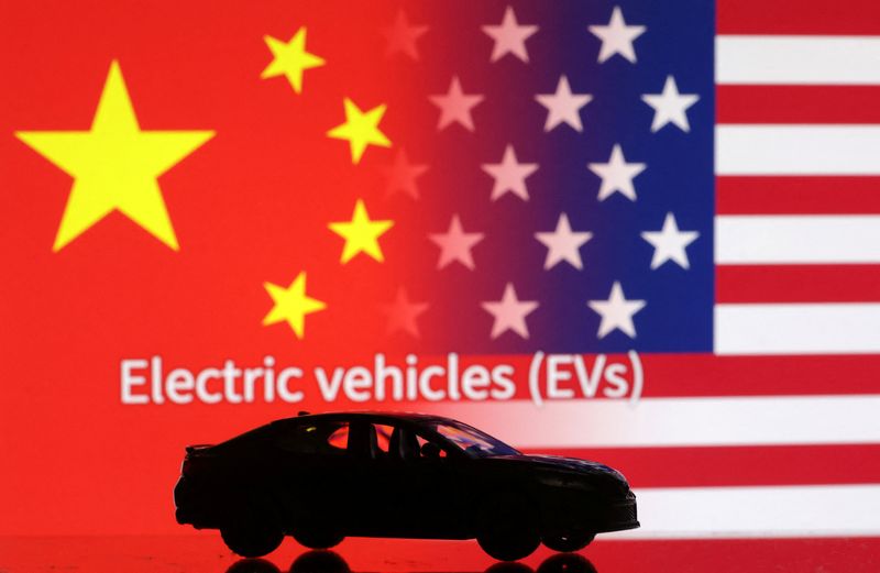 &copy; Reuters. Car miniature, "Electric vechicles (EVs)" words, U.S. and Chinese flags are seen in this illustration taken, September 26, 2023. REUTERS/Dado Ruvic/Illustration