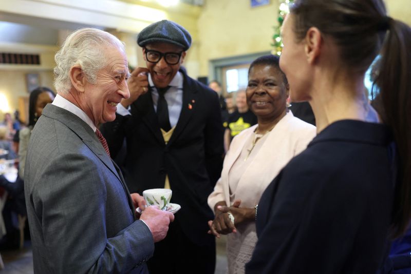 &copy; Reuters. King Charles III's shares a joke with TV presenter Jay Blades and guests as he attends his 75th birthday party hosted by the Prince's Foundation at Highgrove House on November 13, 2023 in Tetbury, England. Guests include local residents who have been nomi