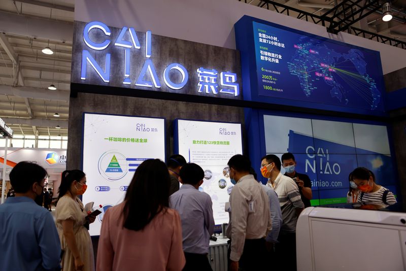 &copy; Reuters. FILE PHOTO: People visit the booth of Alibaba's logistics unit Cainiao at the 2021 China International Fair for Trade in Services (CIFTIS) in Beijing, China September 3, 2021. REUTERS/Florence Lo/File Photo