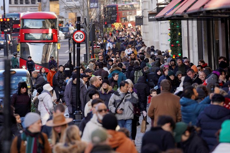 &copy; Reuters. FILE PHOTO: People walk along a busy shopping street, during the traditional Boxing Day sales in London, Britain, December 26, 2022. REUTERS/Maja Smiejkowska/File Photo