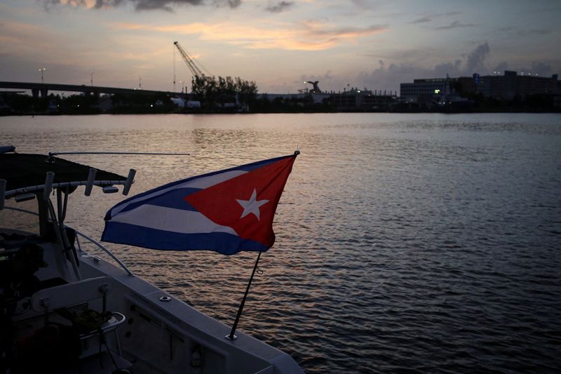 &copy; Reuters. FILE PHOTO: A Cuban flag waves in a boat docked at Bayfront Park is seen before sailing in a flotilla towards Cuba in support of Cuban protesters against its deteriorating economy, in Miami, Florida, U.S. July 23, 2021. REUTERS/Marco Bello/File Photo