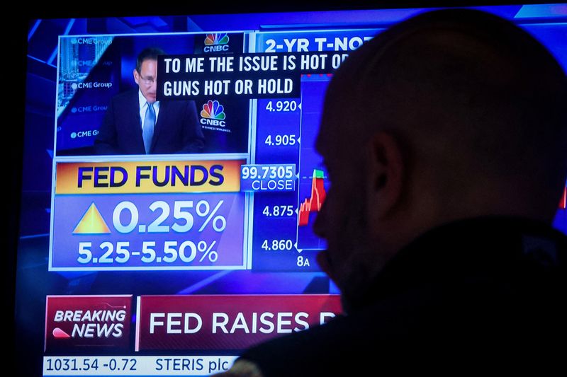 &copy; Reuters. FILE PHOTO: A trader reacts as a screen displays the Fed rate announcement on the floor of the New York Stock Exchange (NYSE) in New York City, U.S., July 26, 2023.  REUTERS/Brendan McDermid/File Photo