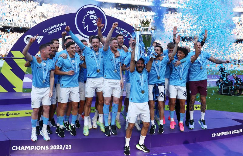 &copy; Reuters. FILE PHOTO: Soccer Football - Premier League - Manchester City v Chelsea - Etihad Stadium, Manchester, Britain - May 21, 2023 Manchester City's Ilkay Gundogan lifts the trophy as he celebrates with team mates after winning the Premier League Action Images