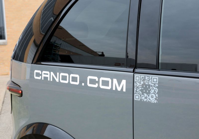 &copy; Reuters. A view shows the Canoo logo on a Canoo LV (Lifestyle Vehicle) electric vehicle outside a manufacturing site in Livonia, Michigan, U.S. November 29, 2022. REUTERS/Rebecca Cook/File Photo