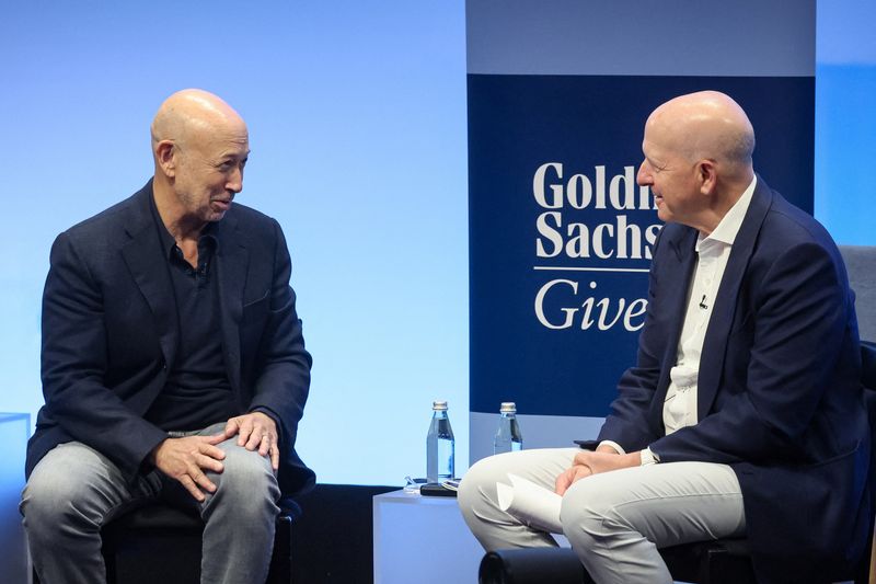 &copy; Reuters. Former Goldman Sachs CEO Lloyd Blankfein and Goldman Sachs chairman and CEO David Solomon speak together during Goldman Sachs analyst impact fund competition at Goldman Sachs Headquarters in New York City, U.S., November 14, 2023. REUTERS/Brendan McDermid