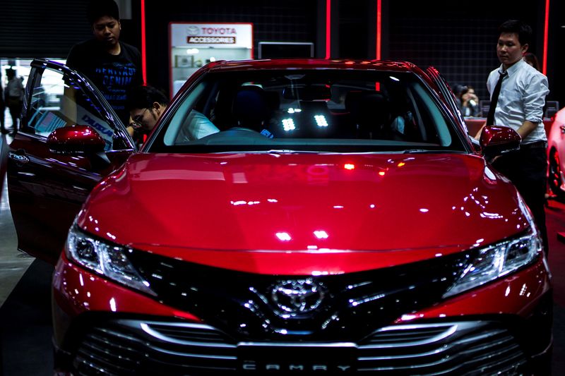 &copy; Reuters. Visitors look at a Toyota Camry car during the Bangkok Auto Salon 2019 in Bangkok, Thailand, July 4, 2019. Picture taken July 4, 2019. REUTERS/Athit Perawongmetha