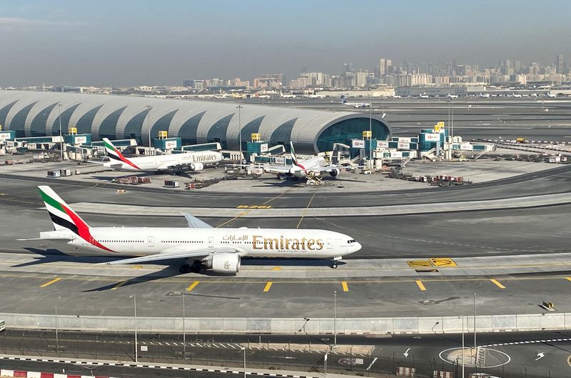&copy; Reuters. Emirates airliners are seen on the tarmac in a general view of Dubai International Airport in Dubai, United Arab Emirates January 13, 2021. Picture taken through a window. REUTERS/Abdel Hadi Ramahi/File Photo