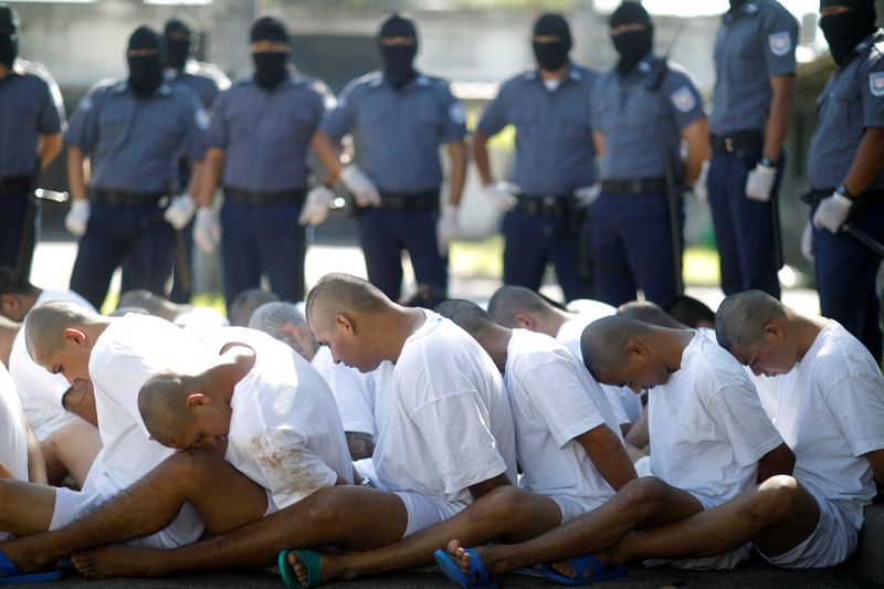 &copy; Reuters. FILE PHOTO: Mara Salvatrucha (MS-13) gang members wait to be escorted upon arrival at the maximum-security jail in Zacatecoluca, El Salvador, January 31, 2019. REUTERS/Jose Cabezas/File Photo