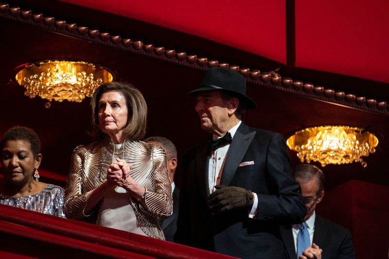 &copy; Reuters. FILE PHOTO: House Speaker Nancy Pelosi and her husband Paul Pelosi, who is wearing a hat and glove following an attack by accused David Wayne DePape in his home in November, attend the Kennedy Center honorees gala in Washington, D.C., U.S., December 4, 20